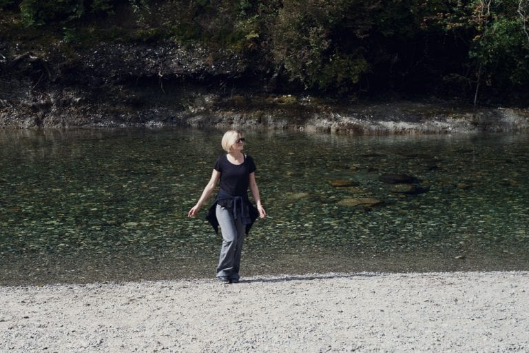 Portrait image of a young woman walking back from a river at Golden Ears Provincial Park