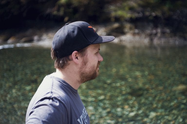 Portrait image of a man looking out over a river at Golden Ears Provincial Park
