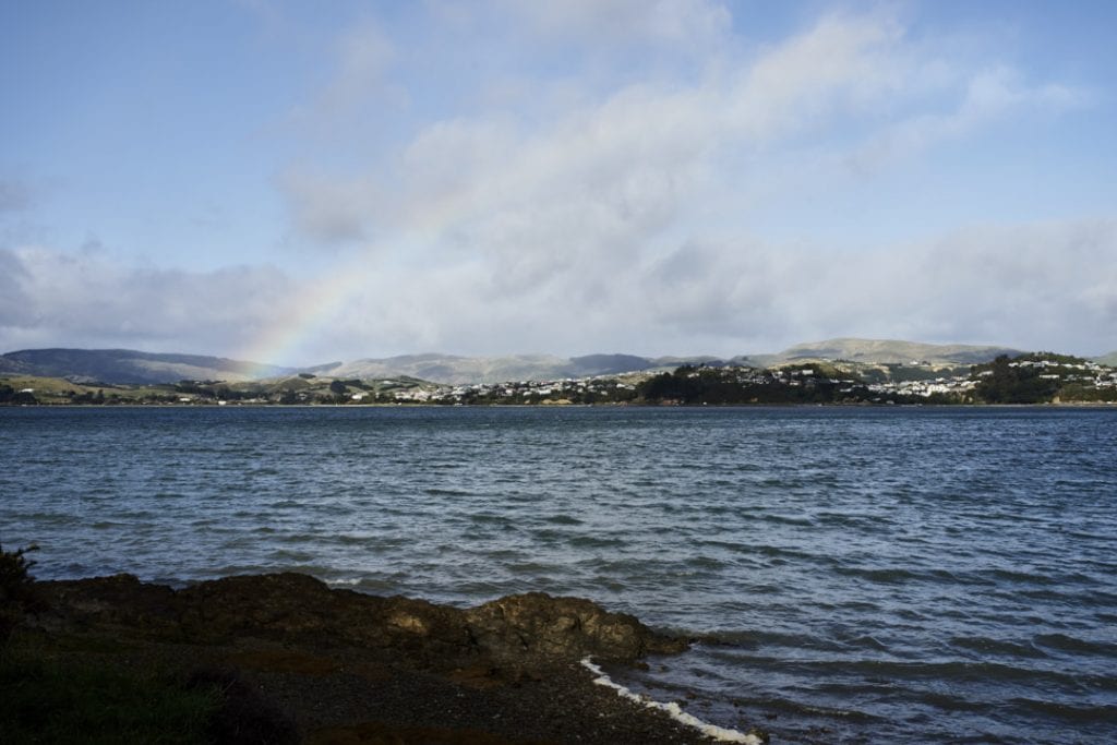 Rainbow across the Pauatahanui inlet with choppy water in the foreground